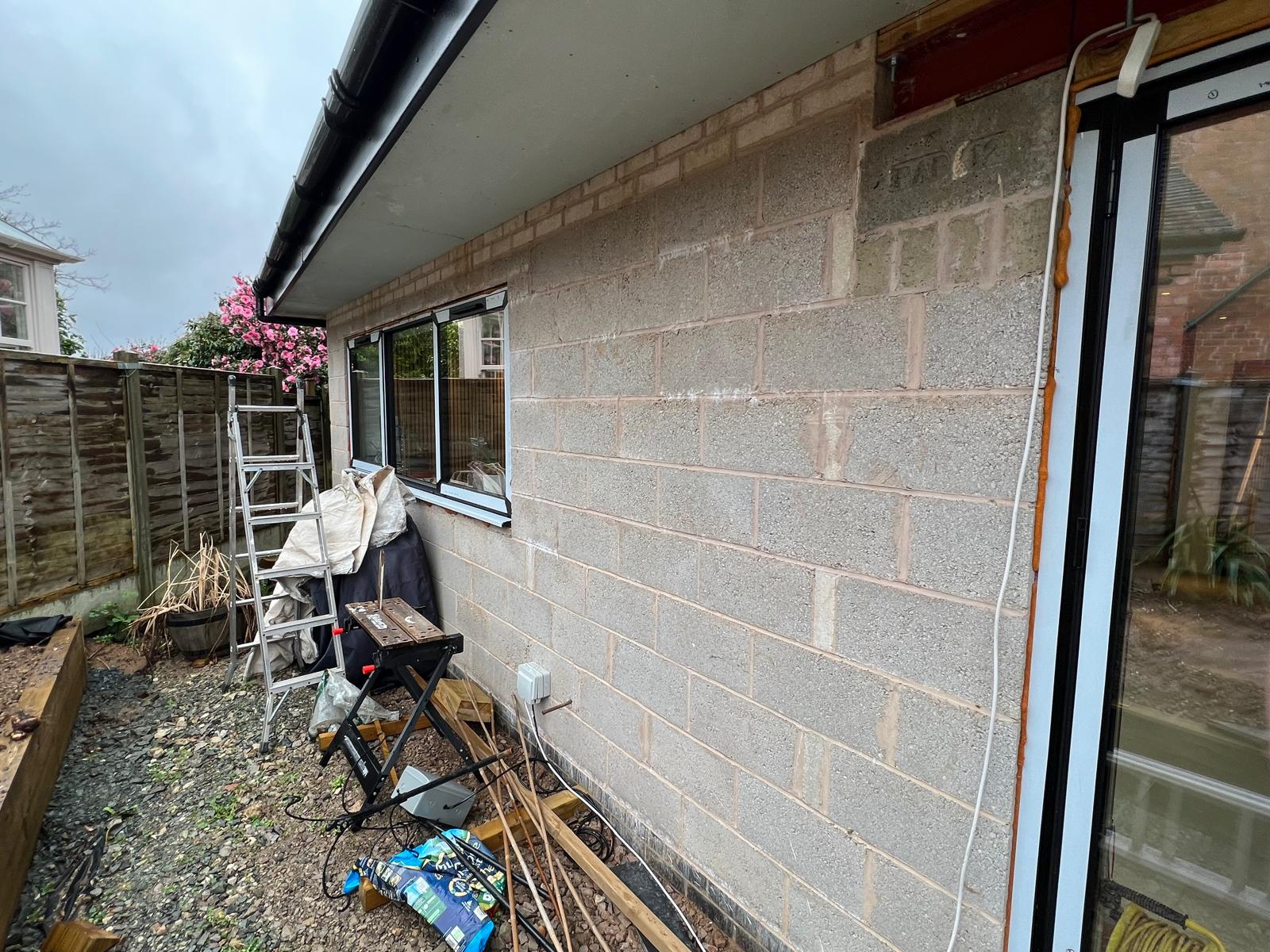 Before: bare blockwork on the rear extension