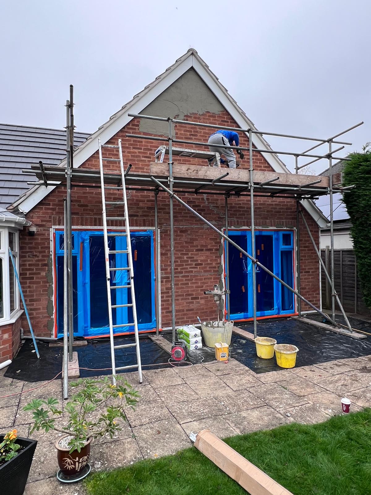 Before: bare brick gable on the rear, pre-render