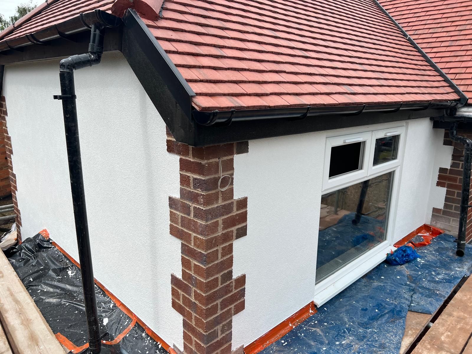 Bungalow with red-brick quoins kept exposed