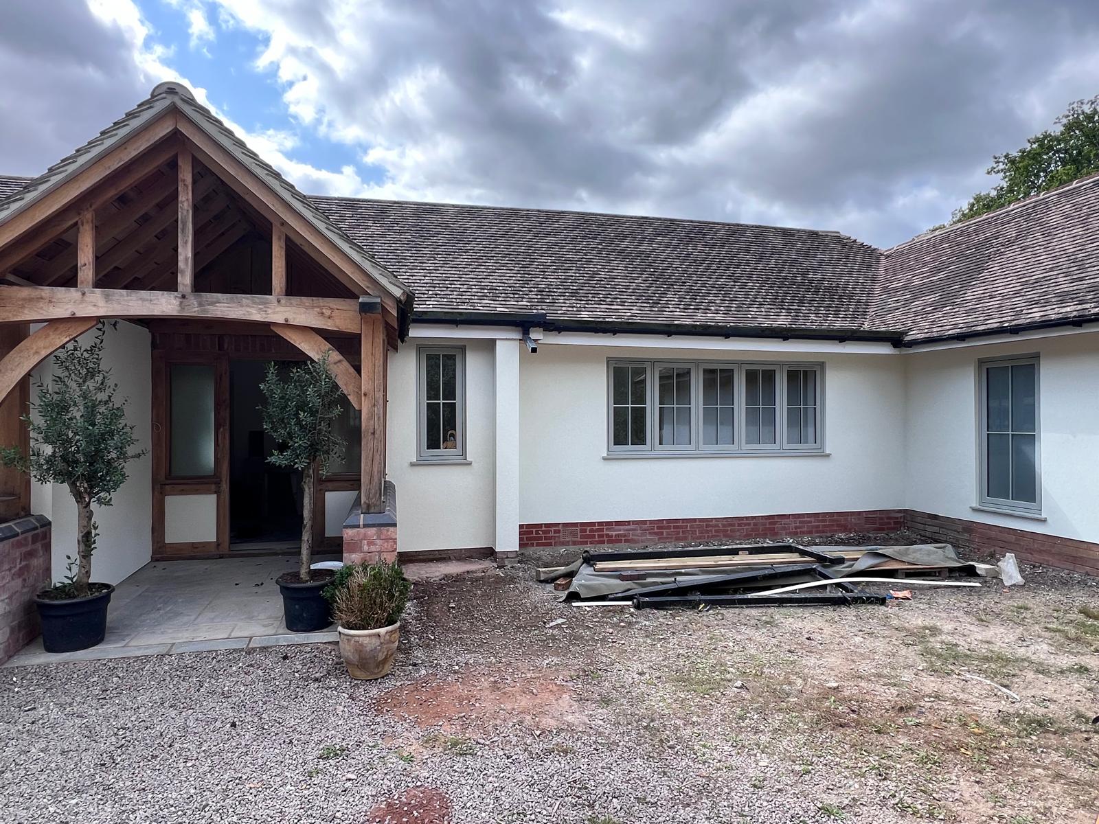 Bungalow silicone render with oak porch