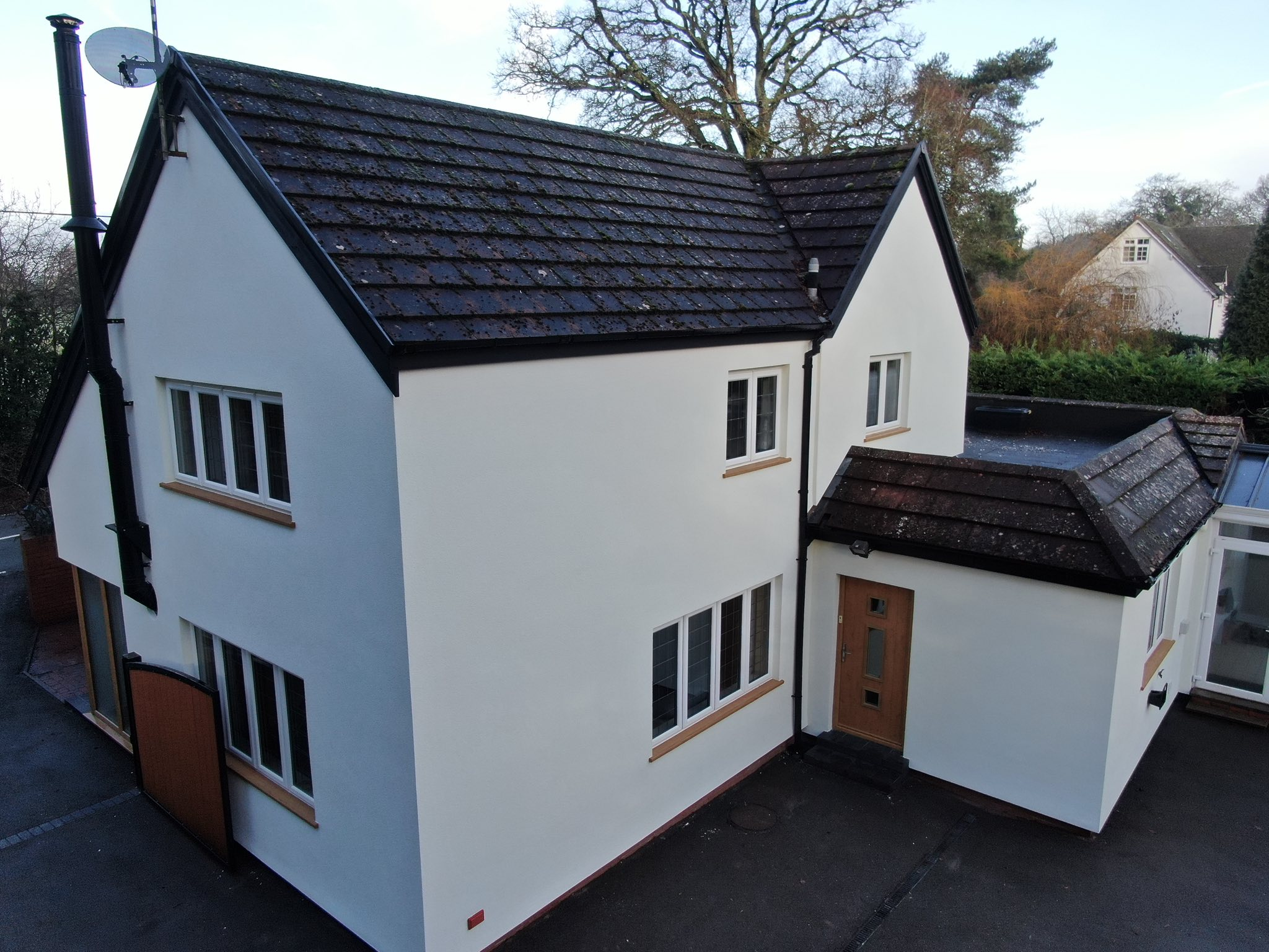The Oaks finished in clean white render after EWI