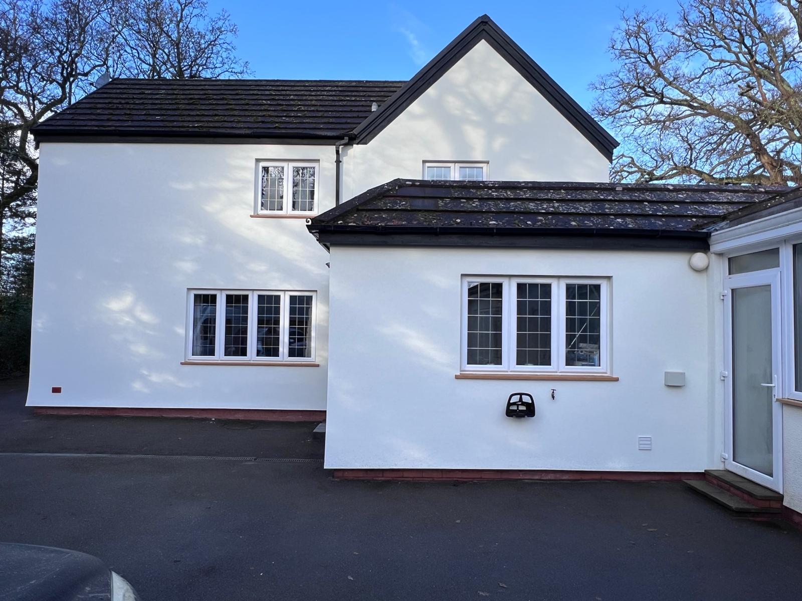 The Oaks finished in clean white render after EWI